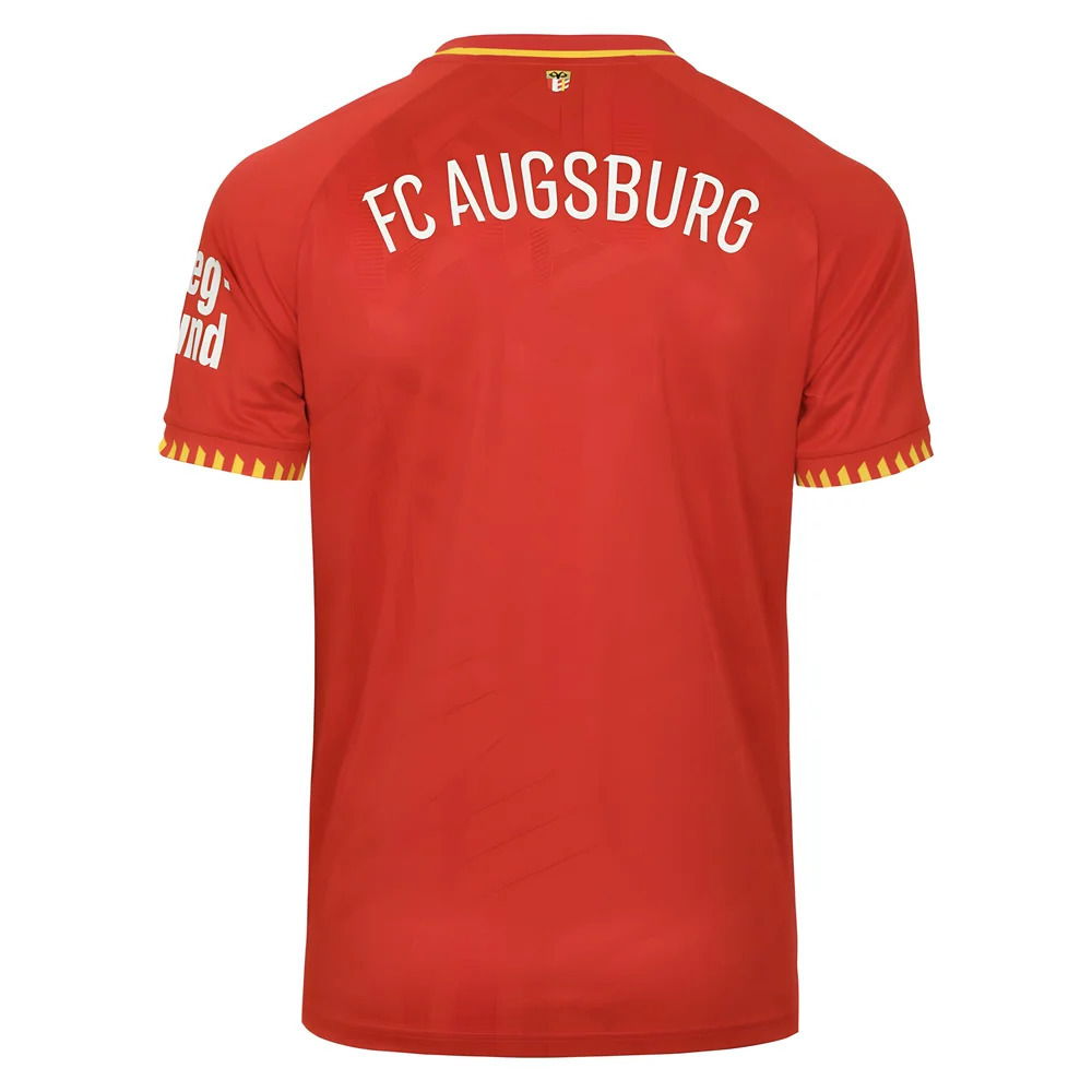 FC Augsburg 2025/2026 Away Jersey. Solid red with yellow collar and cuff accents, subtle Swabian coat-of-arms jacquard pattern, and FCA crest.