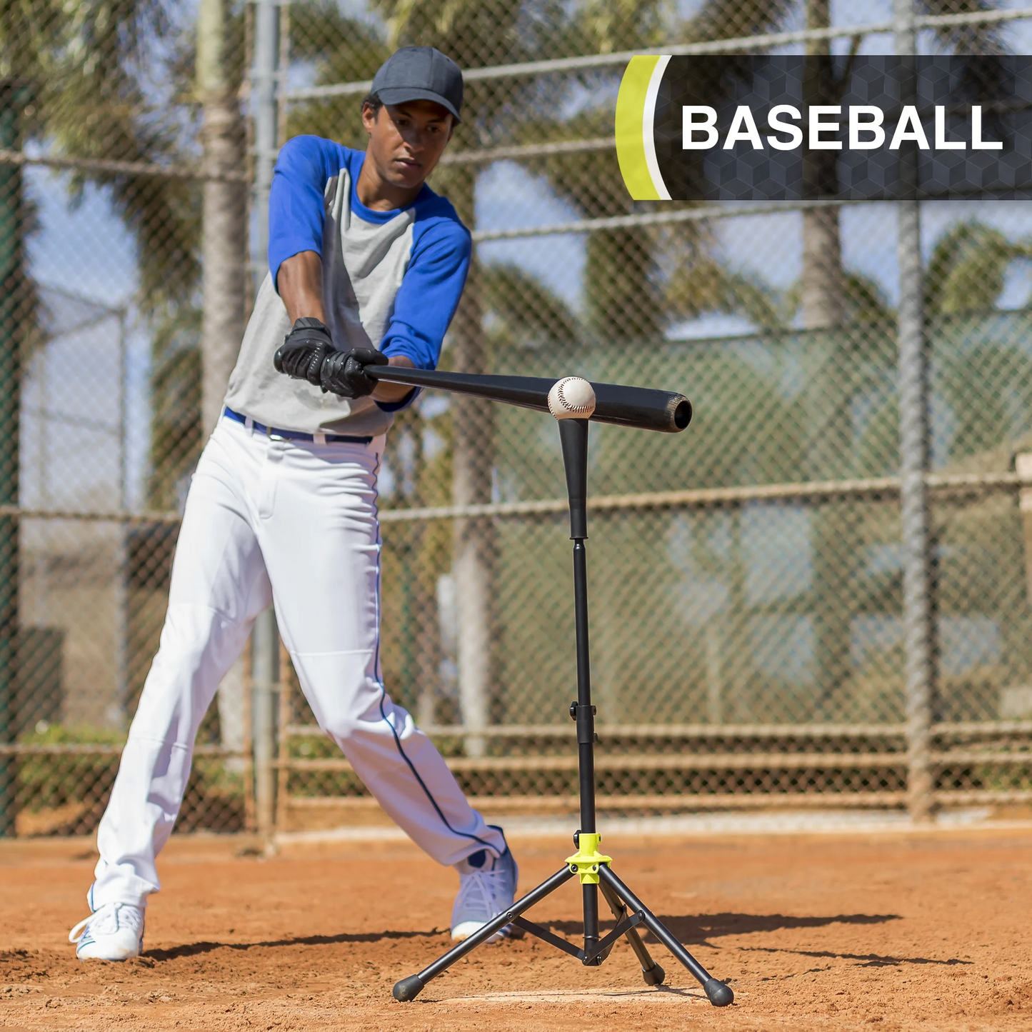Person practicing baseball batting with a stand on a field