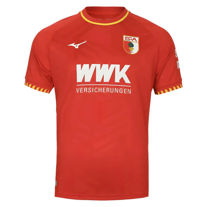 FC Augsburg 2025/2026 Away Jersey. Solid red with yellow collar and cuff accents, subtle Swabian coat-of-arms jacquard pattern, and FCA crest.